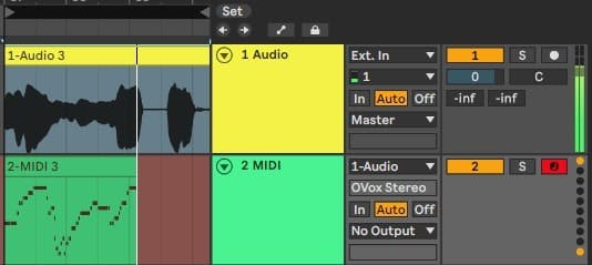 Record arm the MIDI track and play audio trough the audio track.